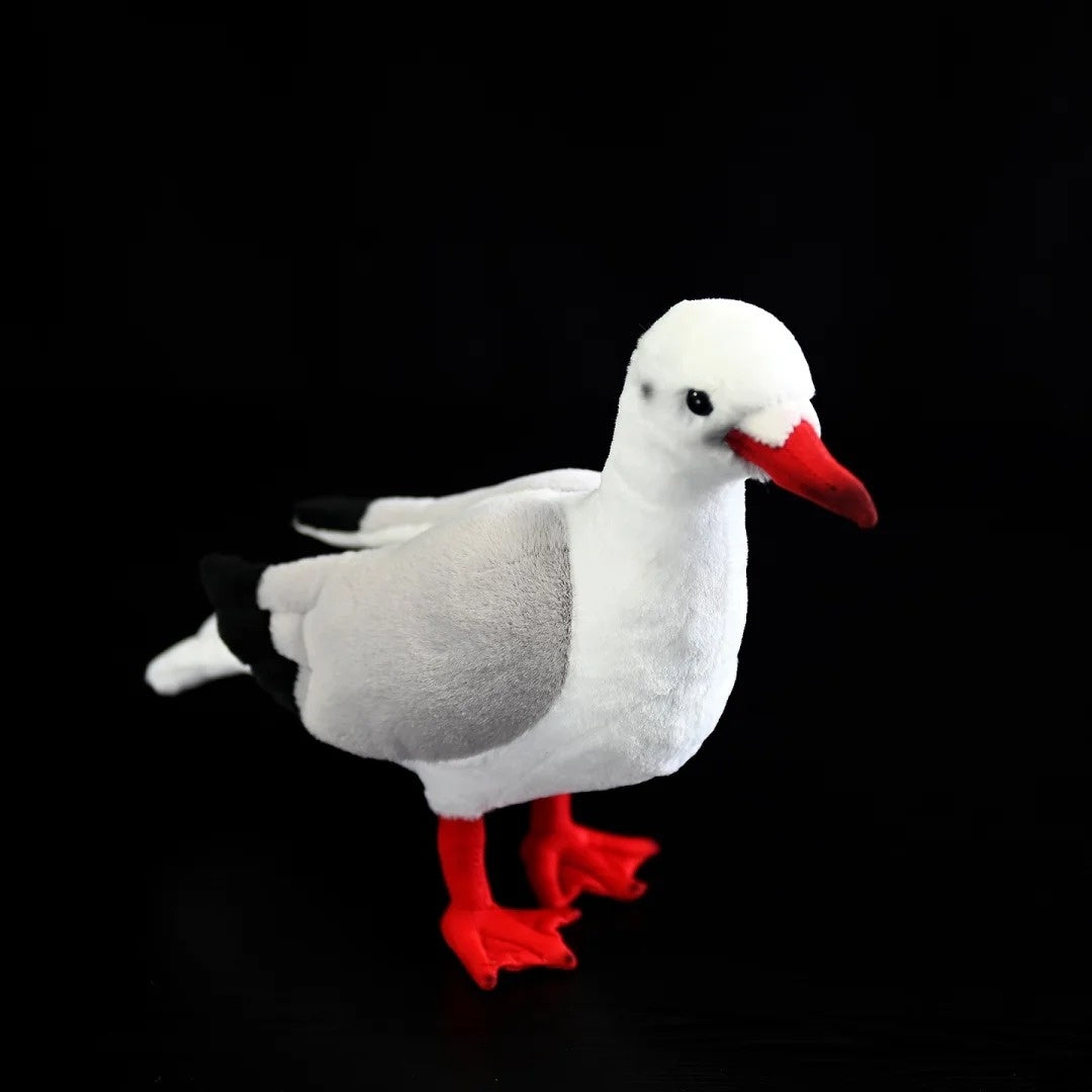 Black-headed Gull stuffed toy standing elegantly, featuring gray wings, a red beak, and red feet