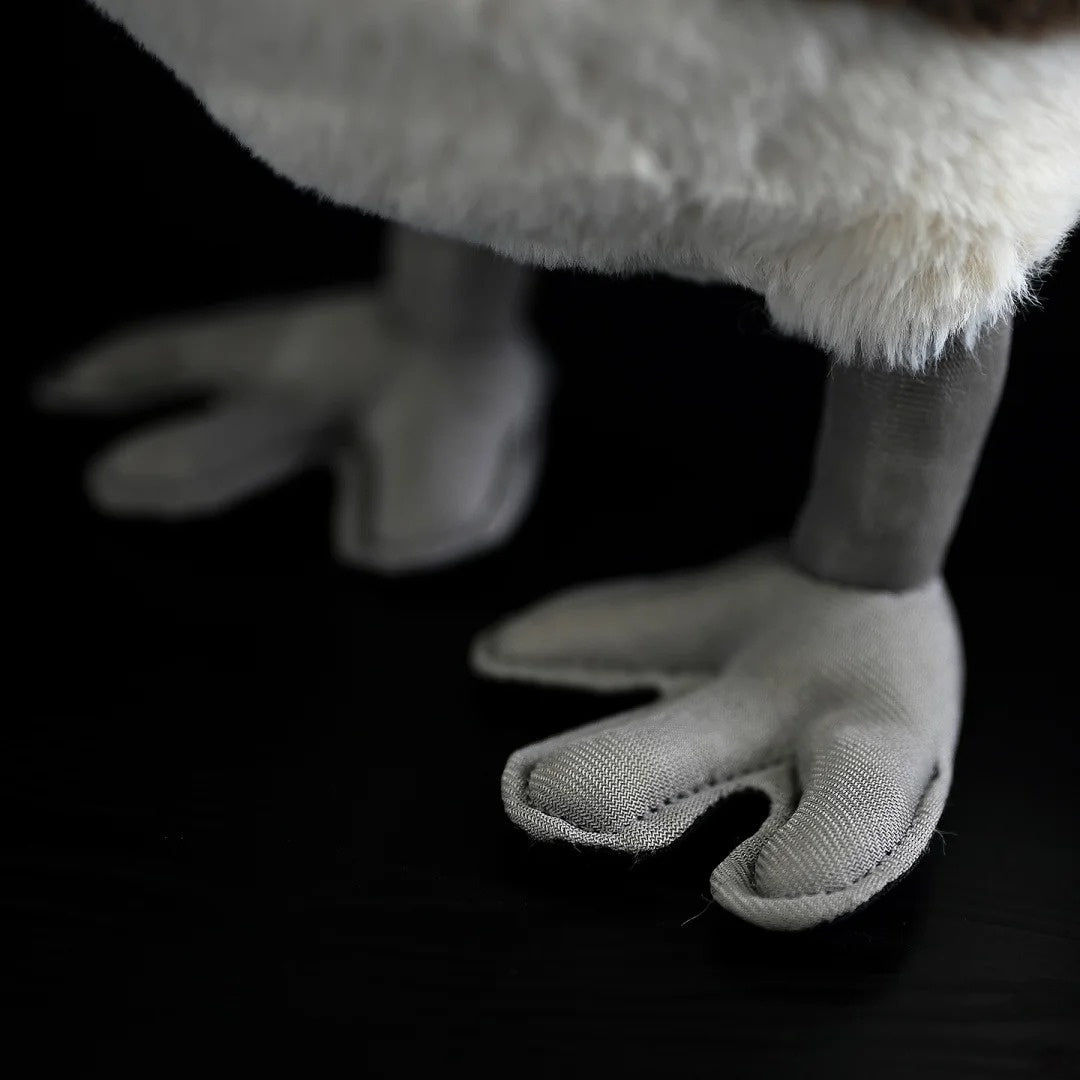 Focused view of Little Grebe plush toy's webbed feet, designed with realistic details for bird enthusiasts