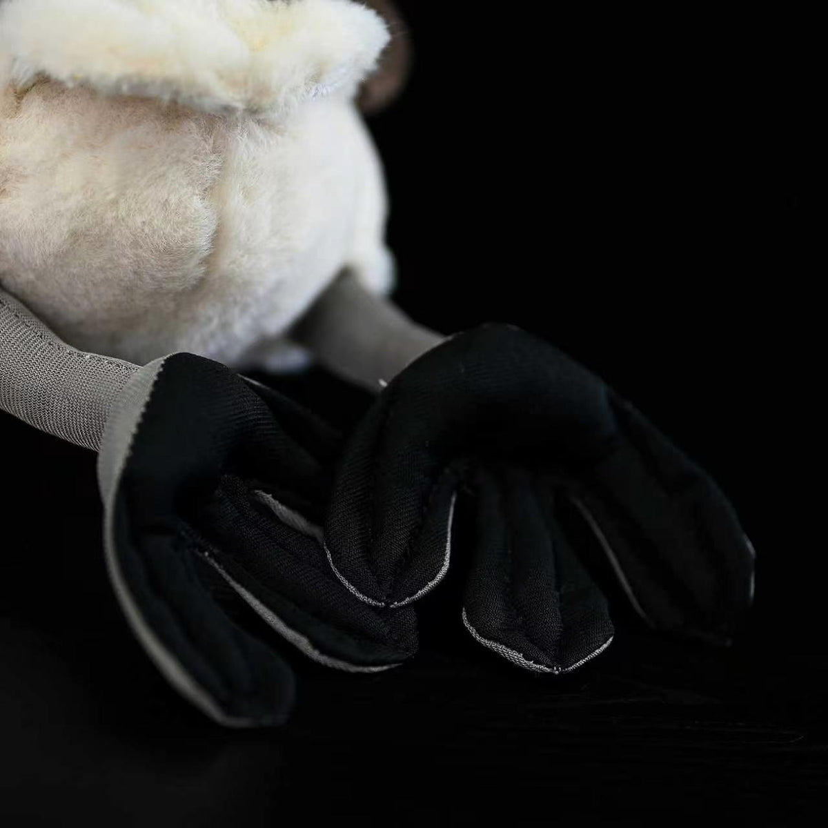 Focused view of Little Grebe plush toy's webbed feet, designed with realistic details for bird enthusiasts