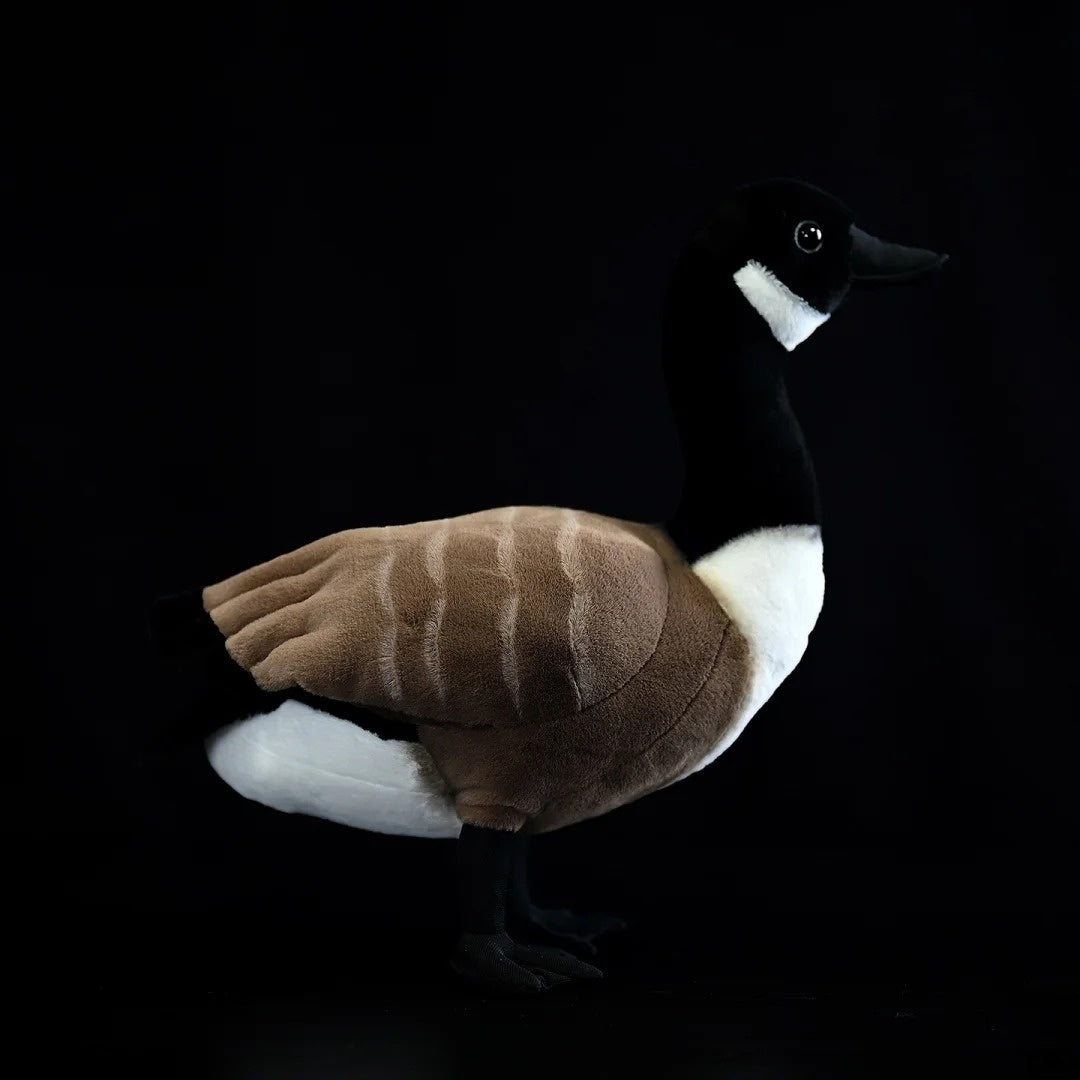 Side view of a detailed Canada Goose stuffed animal, featuring lifelike textures and colors