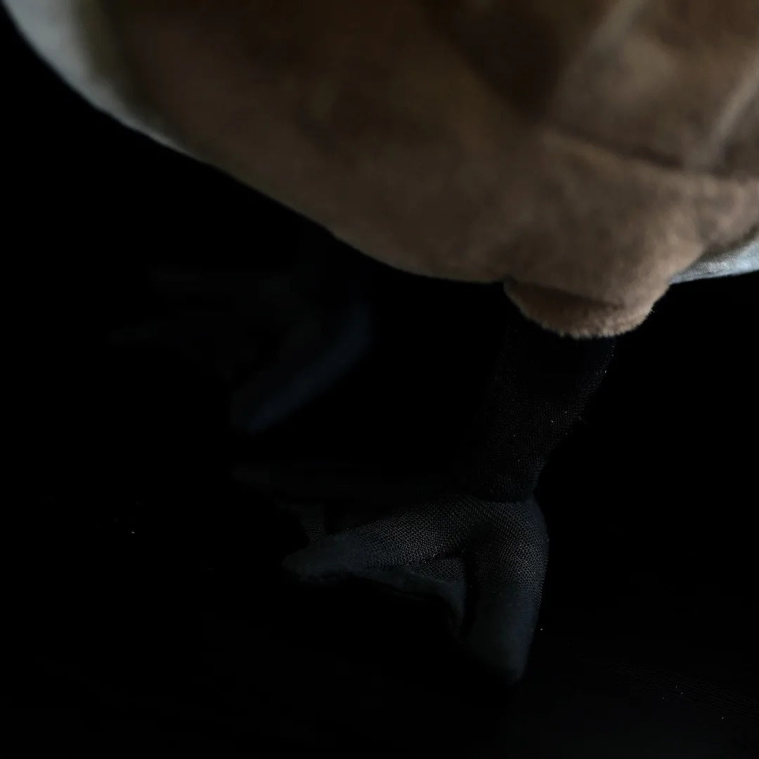 Close-up of the foot of a Canada Goose plush toy, highlighting realistic design elements