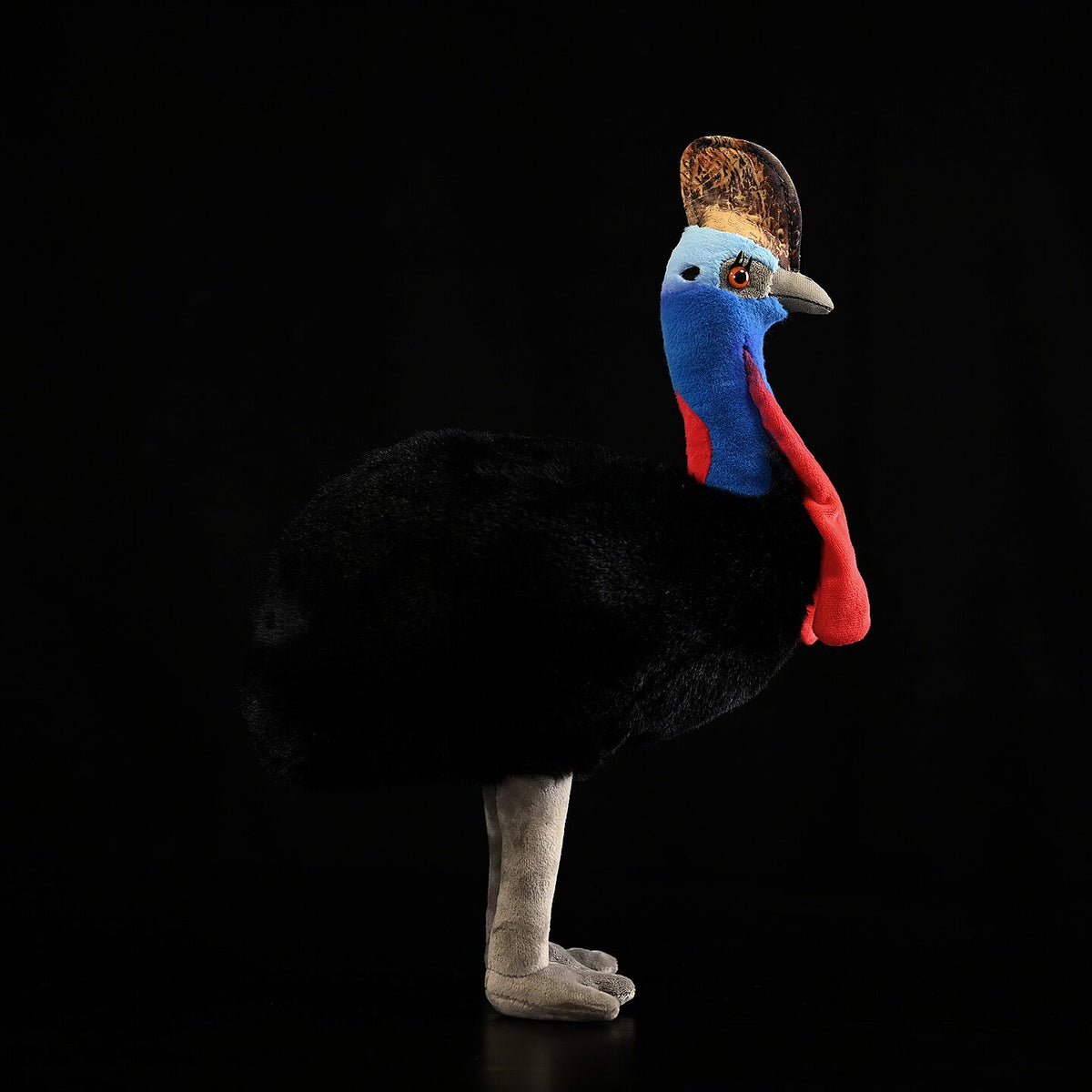 Side view of a Southern Cassowary plush toy showcasing lifelike colors and design