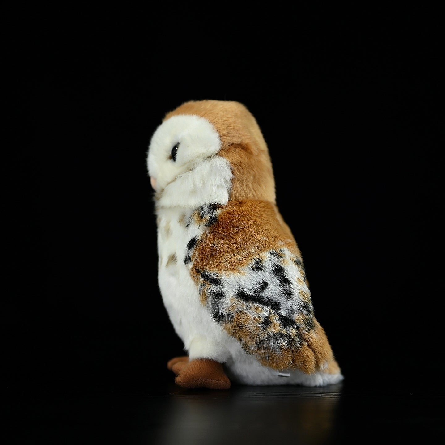 Side profile of the cute and cuddly Barn Owl Plush Toy with a detailed rotatable head design