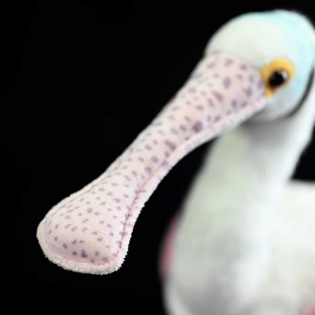 Close-up of Roseate Spoonbill’s spoon-shaped bill on the plush toy, capturing its realistic texture