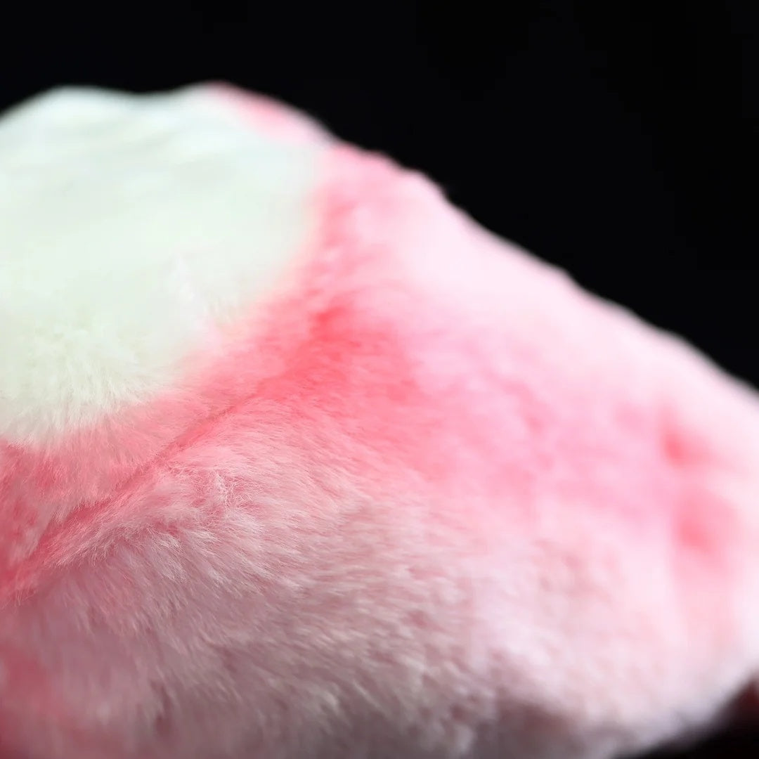 Close-up of the plush's soft pink feathers, perfectly mimicking the Roseate Spoonbill's natural colors