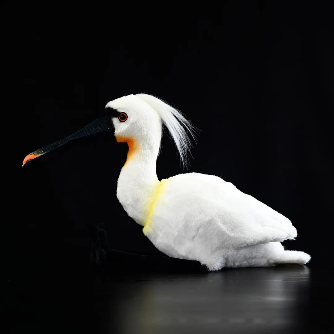 Side profile of the Eurasian Spoonbill plush, highlighting its lifelike crest and realistic yellow breast patch