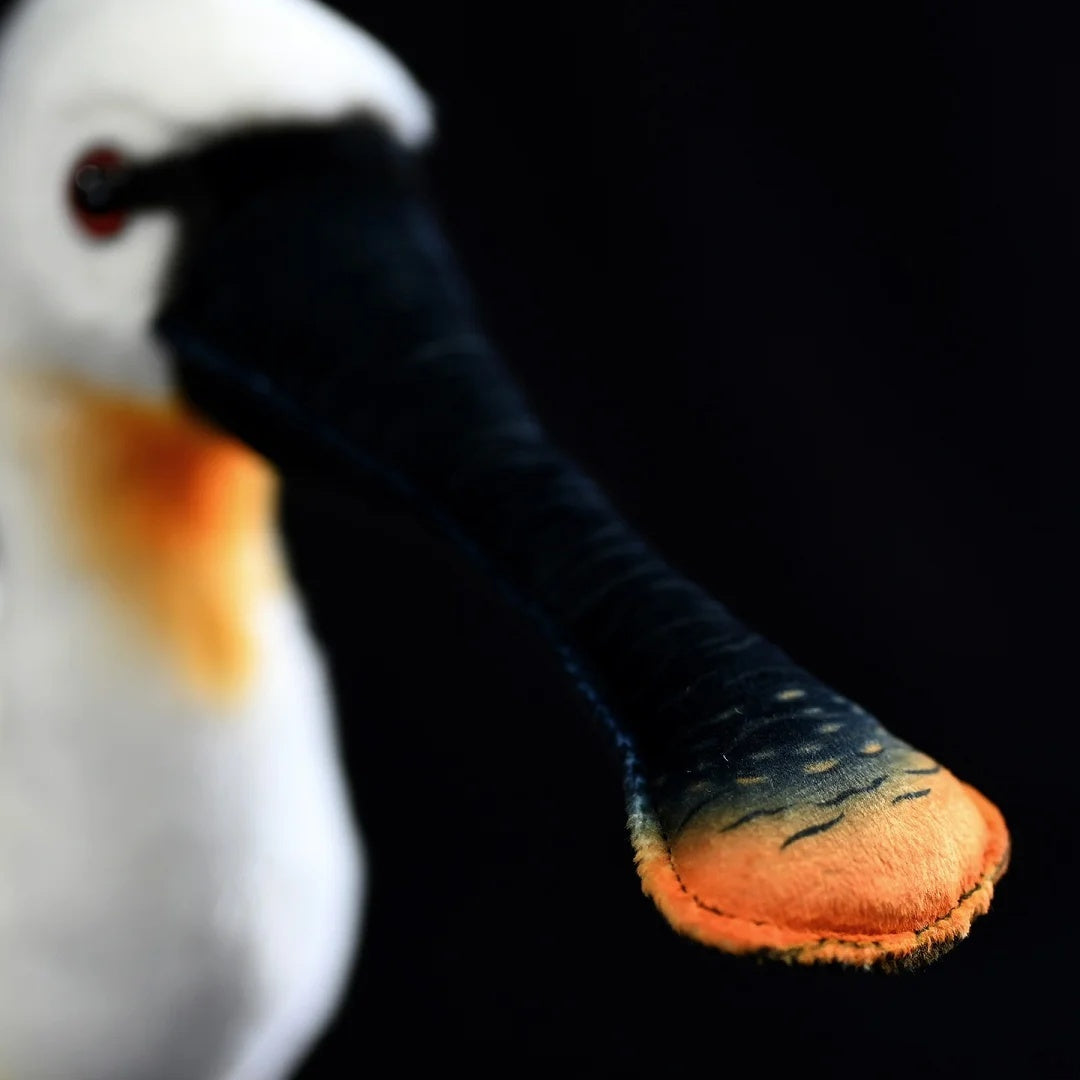 Close-up of the Eurasian Spoonbill plush with a detailed black bill featuring orange tip accents