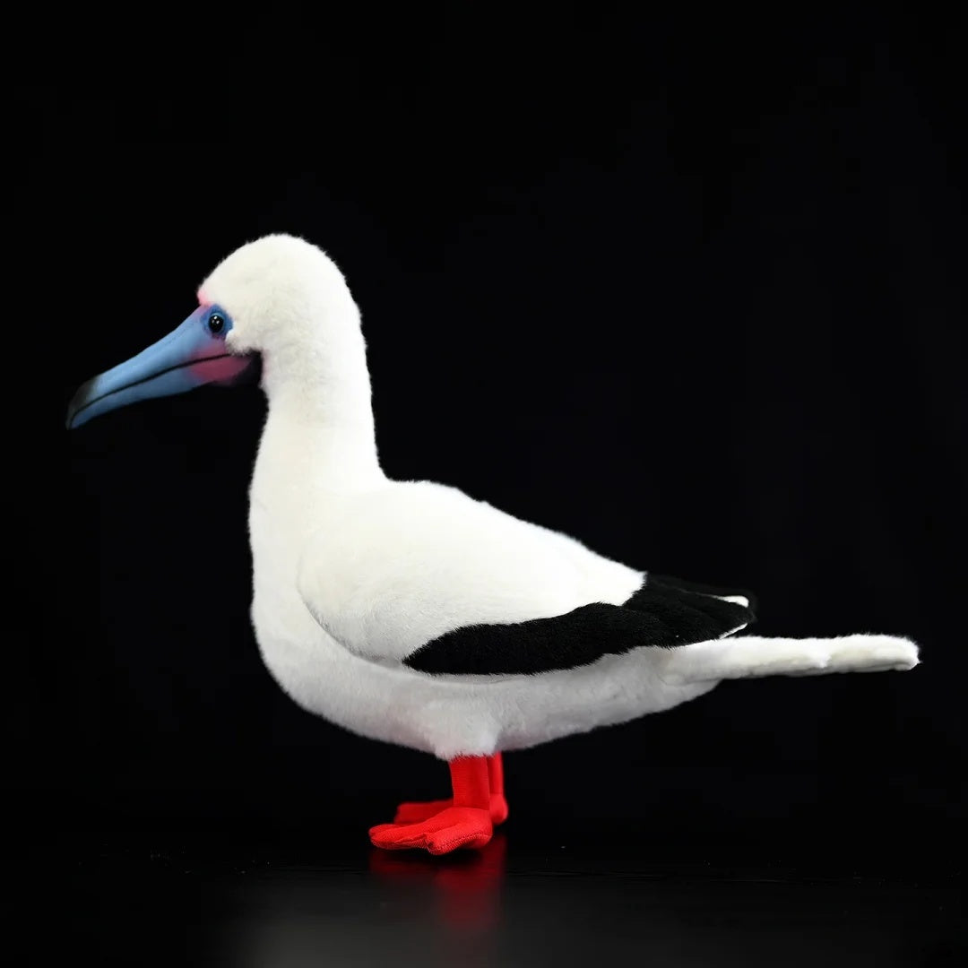 Side profile of Red-footed Booby plush toy, highlighting realistic wings and soft texture for collectors