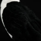 Detailed texture view of the Daurian Jackdaw plush, showcasing its soft black feathers for a lifelike feel