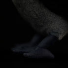 Close focus on the feet of a Western Jackdaw plush, demonstrating realistic design and quality craftsmanship