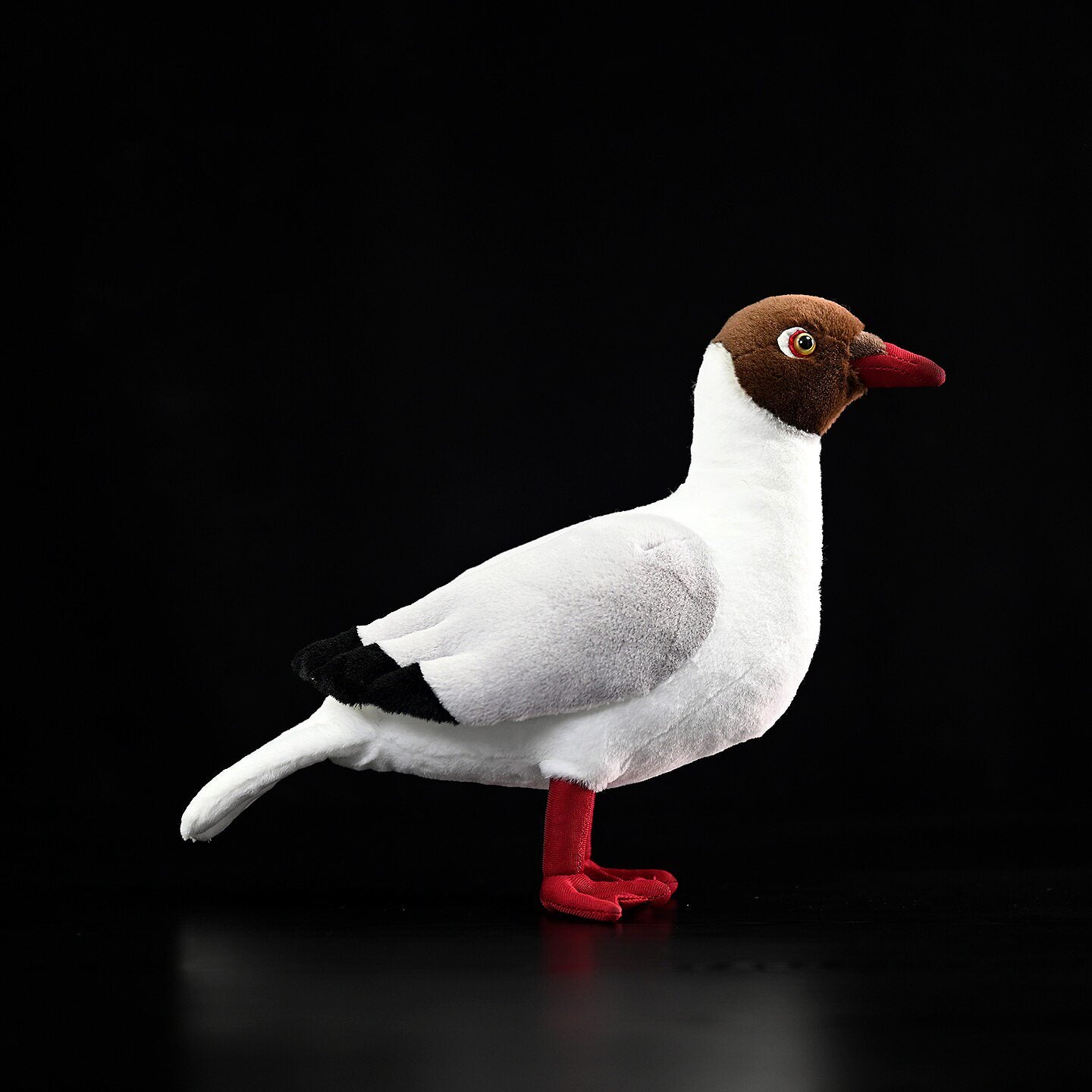 Side view of a Brown-headed Gull plush by SoftDaysLab, featuring realistic details and soft textures