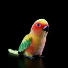 Front-angle of a Sun Conure plush toy by SoftDaysLab®, highlighting its realistic orange and yellow tones