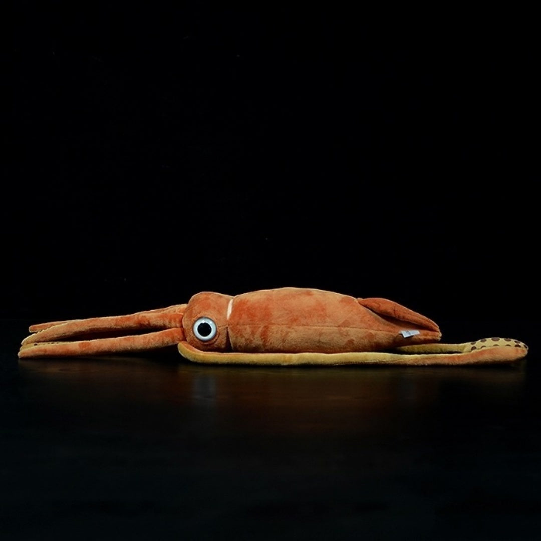 Side view of a lifelike giant squid plush toy, featuring vivid orange tones and intricate design by SoftDaysLab