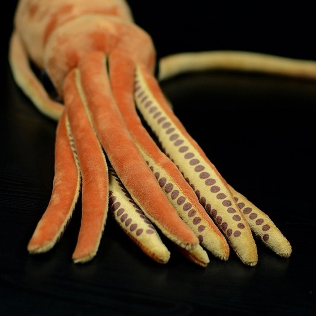 Close-up of giant squid plush toy's tentacles with suction cup patterns, perfect for ocean lovers