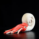 Full side view of Perisphinctes ammonite plush by SoftDaysLab, featuring a coiled shell and vivid tentacles