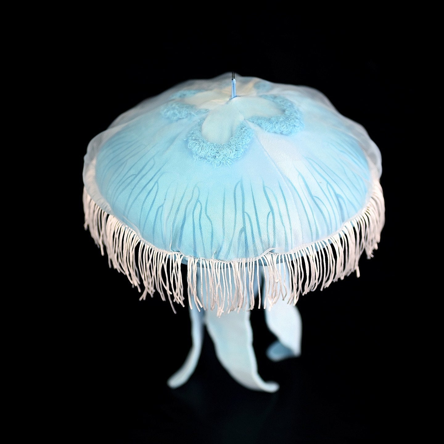 Top view of a realistic Moon Jellyfish Plush showcasing intricate translucent details and elegant design
