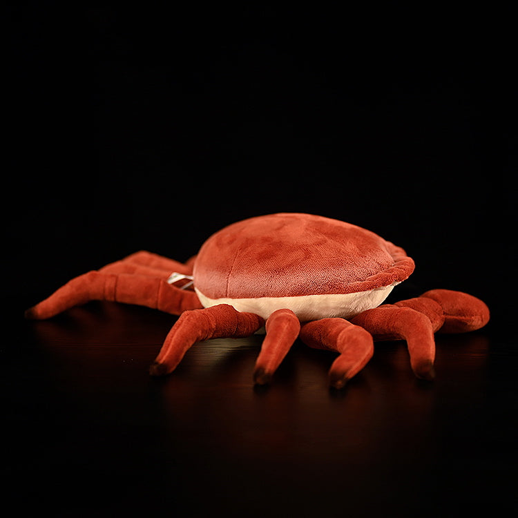 Side view of the Edible Crab Plush by SoftDaysLab, highlighting its lifelike shell and soft, realistic legs