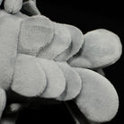 Close-up of giant isopod plush underside, highlighting soft texture and realistic design