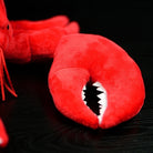 Close-up of the claw on the American lobster plush toy, showcasing realistic texture and design