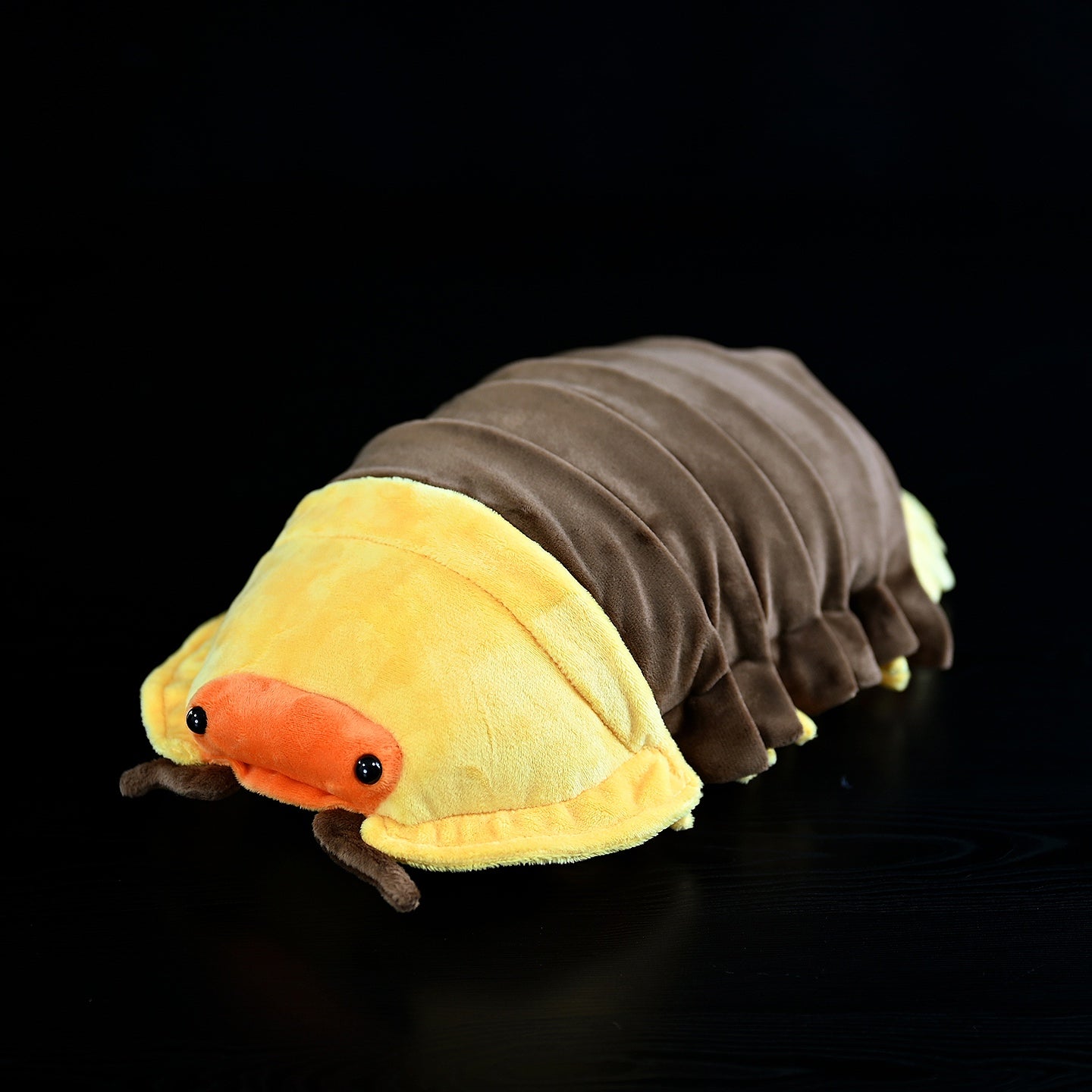 Side perspective of the Rubber Ducky Isopod Plush Toy, highlighting its lifelike segmented body design