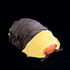 Angled view of the isopod plush, featuring its charming duck-like face and captivating details