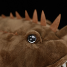 Detailed view of the eye and spines on American Monkfish plush, replicating the unique features of the species