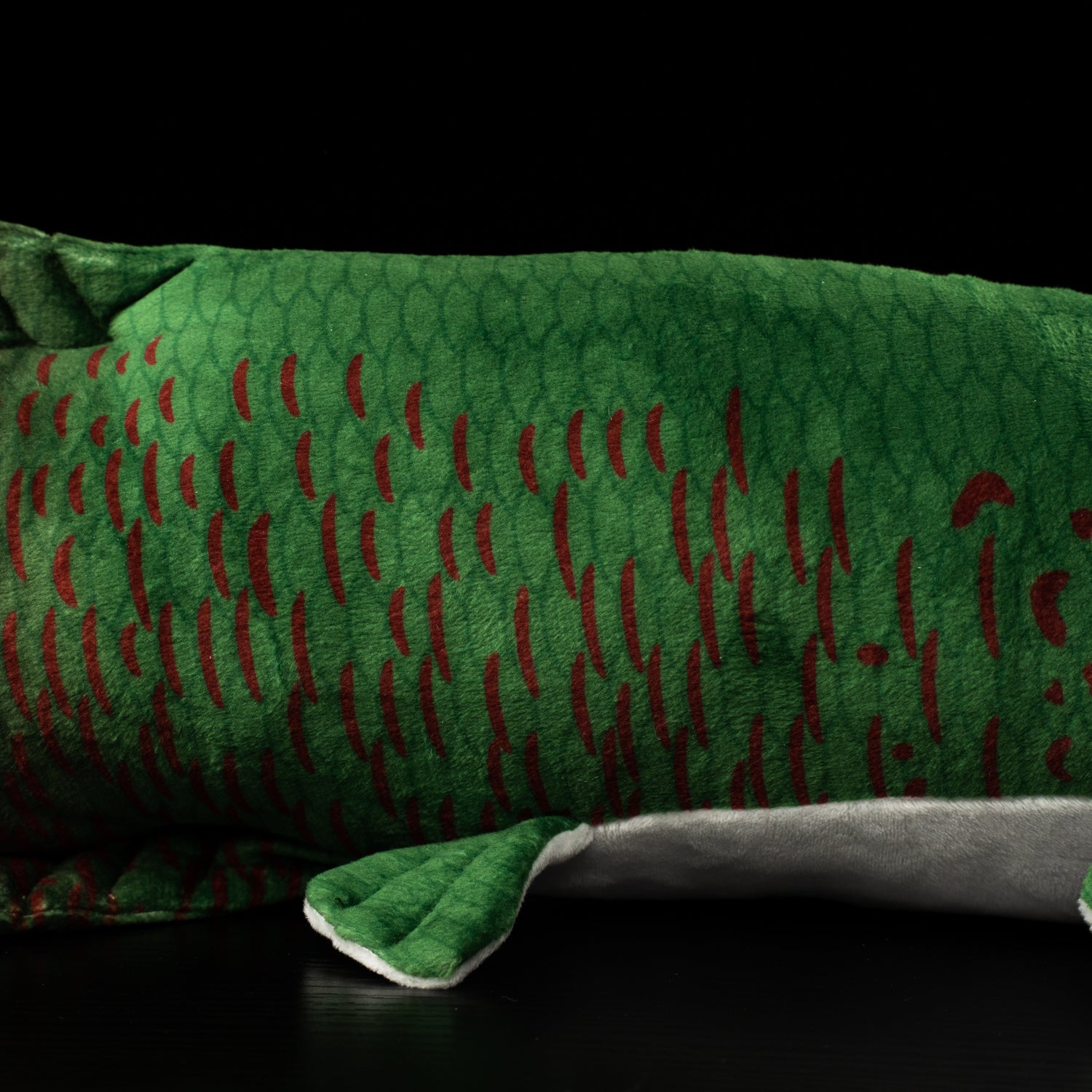 Middle section close-up of an Arapaima gigas plush with vibrant green scales and red details, premium by SoftDaysLab