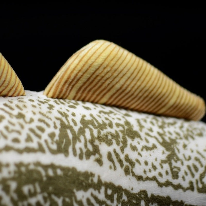 Detailed view of the dorsal fin of Atlantic cod plush toy with lifelike texture and color accuracy