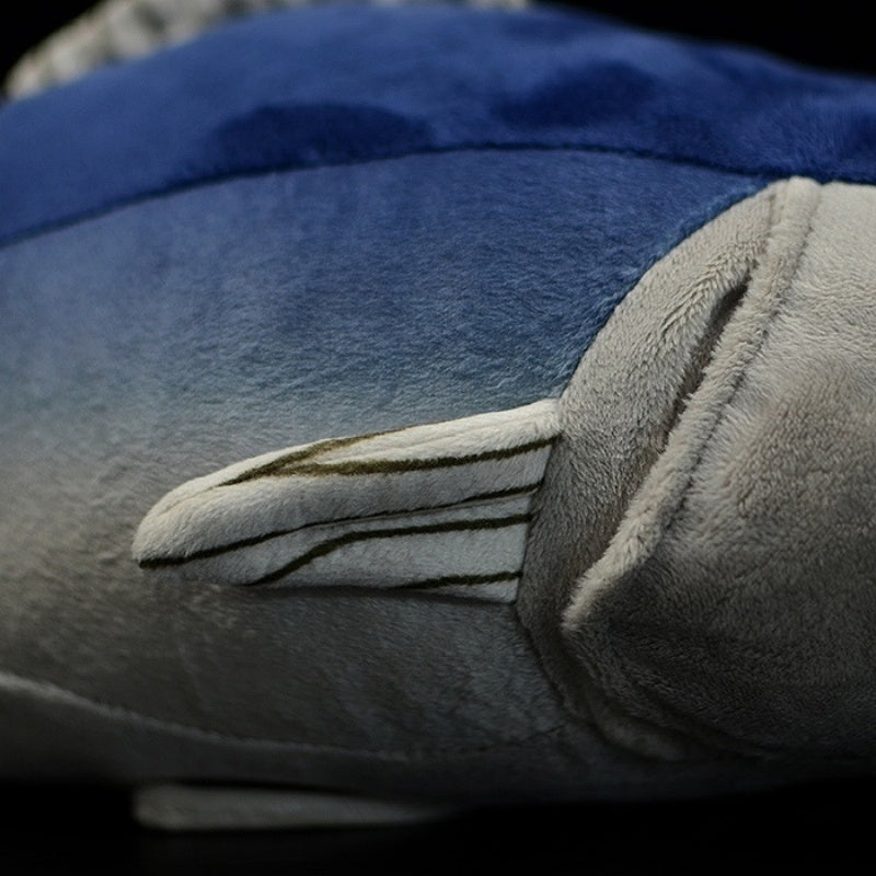 Close-up of Atlantic Bluefin Tuna plush toy’s side fin with striped design and soft texture