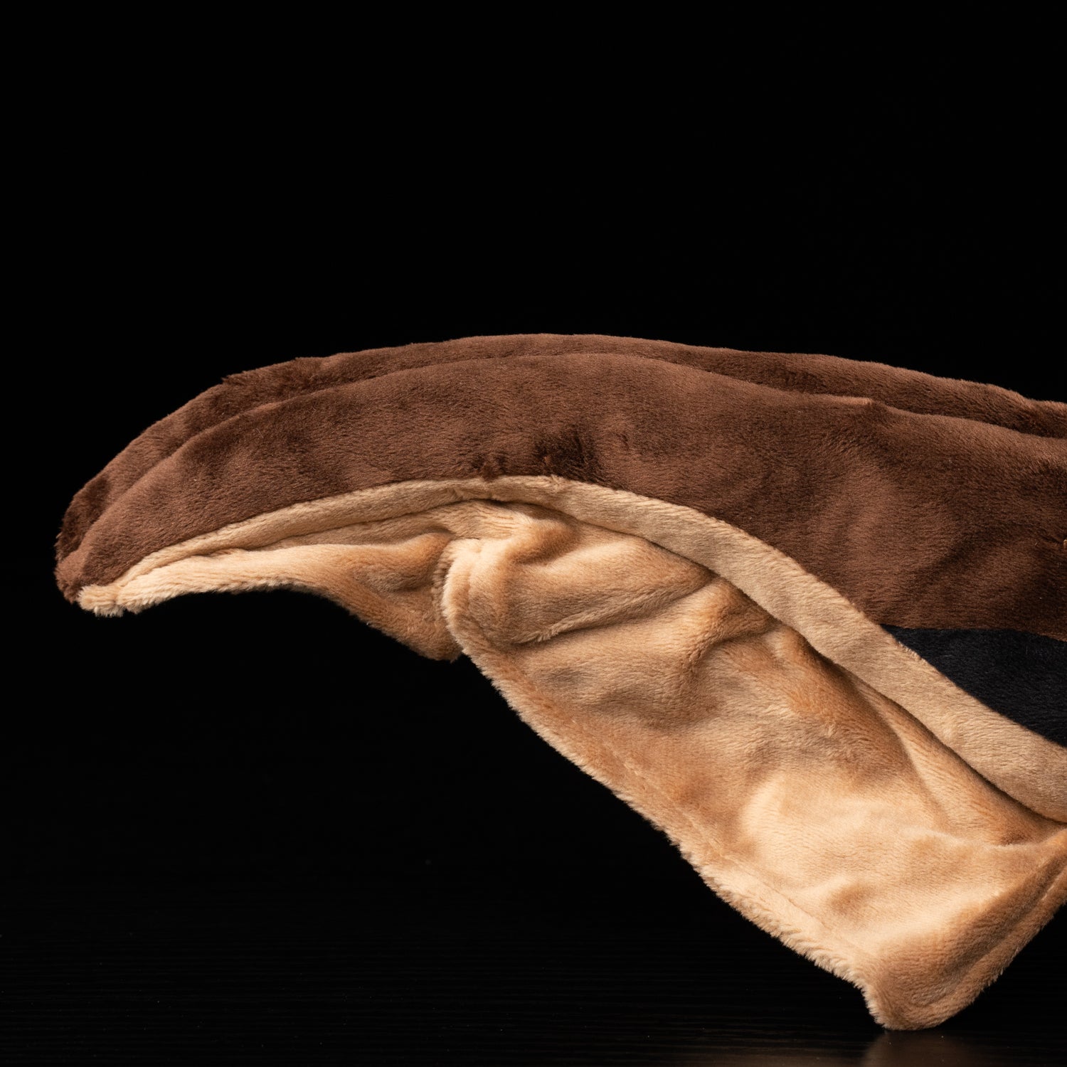 Tail close-up of Dunkleosteus plush showcasing soft, flowing fabric for a lifelike prehistoric feel