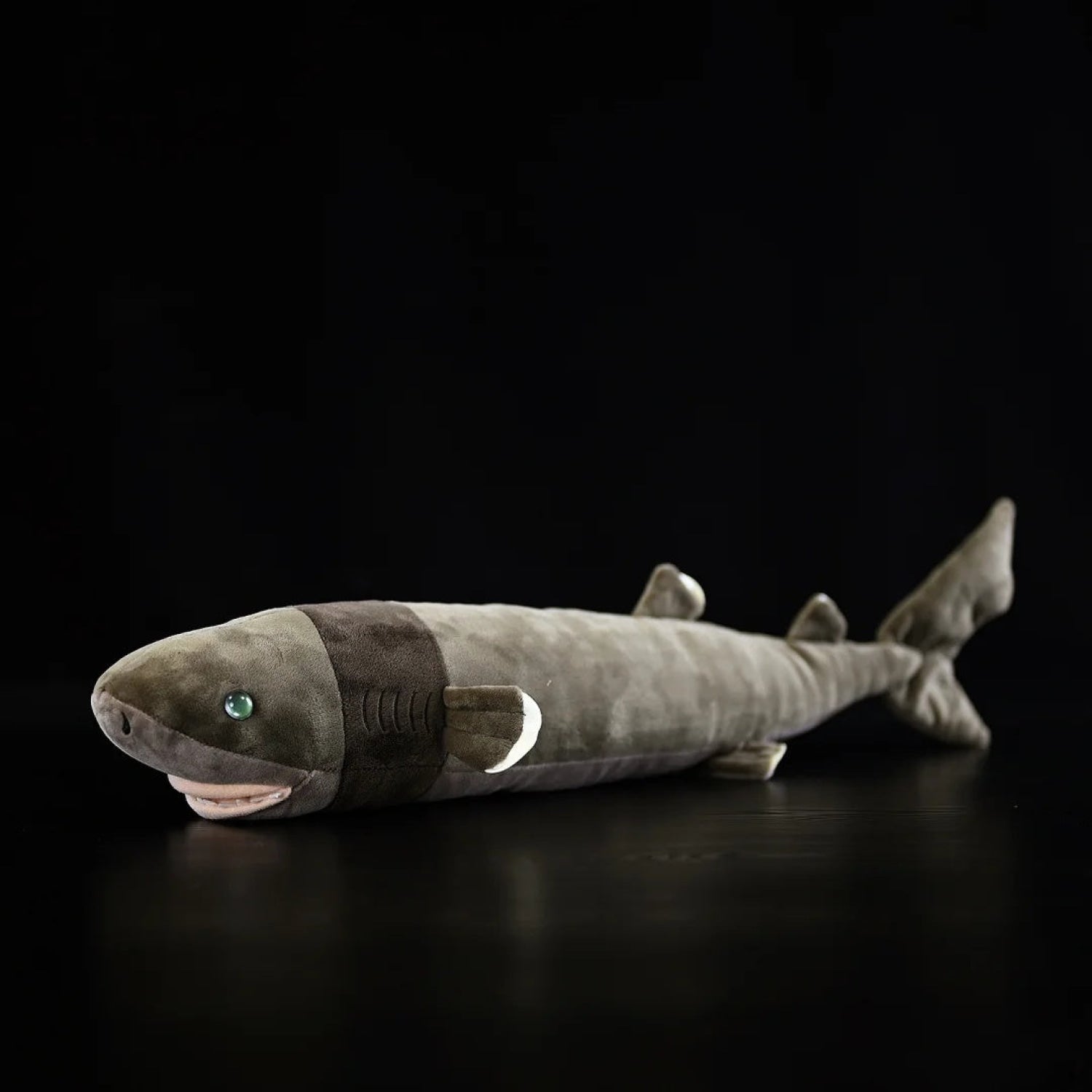 Realistic cookiecutter shark plush toy with lifelike details and soft texture