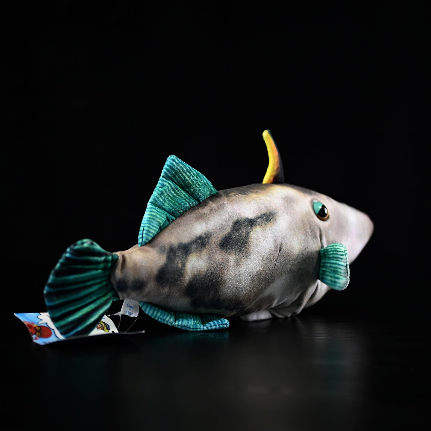 Side profile of a Greenfin Horse-Faced Filefish plush, highlighting realistic patterns and soft fabric