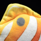 Close-up of the dorsal fin and iconic eye-spot of a Copperband Butterflyfish plush toy