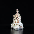 Front view of a lifelike spotted scat stuffed animal with realistic spots and soft texture