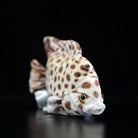 Side angle of a spotted scat plush toy, highlighting its realistic fish-like design and charming details