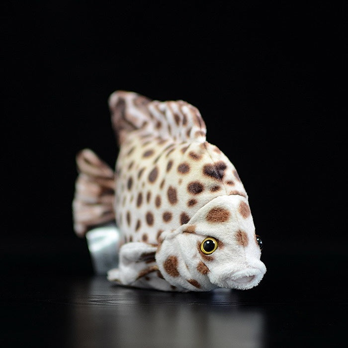 Side angle of a spotted scat plush toy, highlighting its realistic fish-like design and charming details