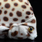 Detailed side view of the spotted scat plush, emphasizing its lifelike spots and soft texture