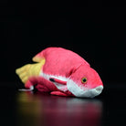 Side angle of the Cuban Spotfin Hogfish plush toy, featuring its vivid colors and soft texture