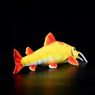 Back angle of Golden Redtail Catfish Plush by SoftDaysLab® highlighting its bright red tail and fins