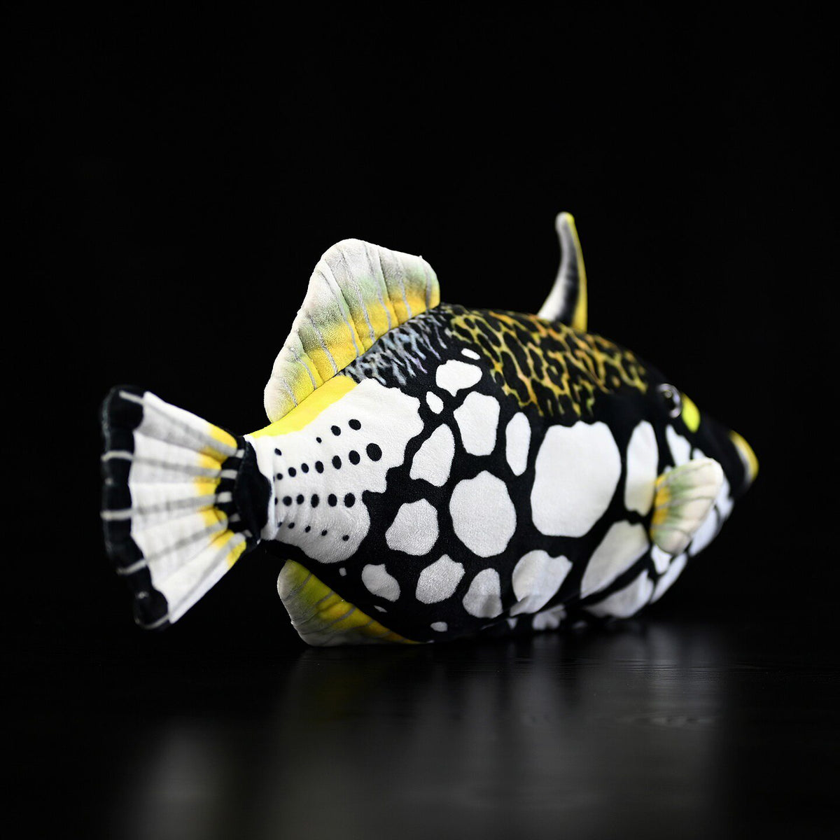 Rear-side view of the Clown Triggerfish plush by SoftDaysLab®, highlighting its spotted and vibrant tail