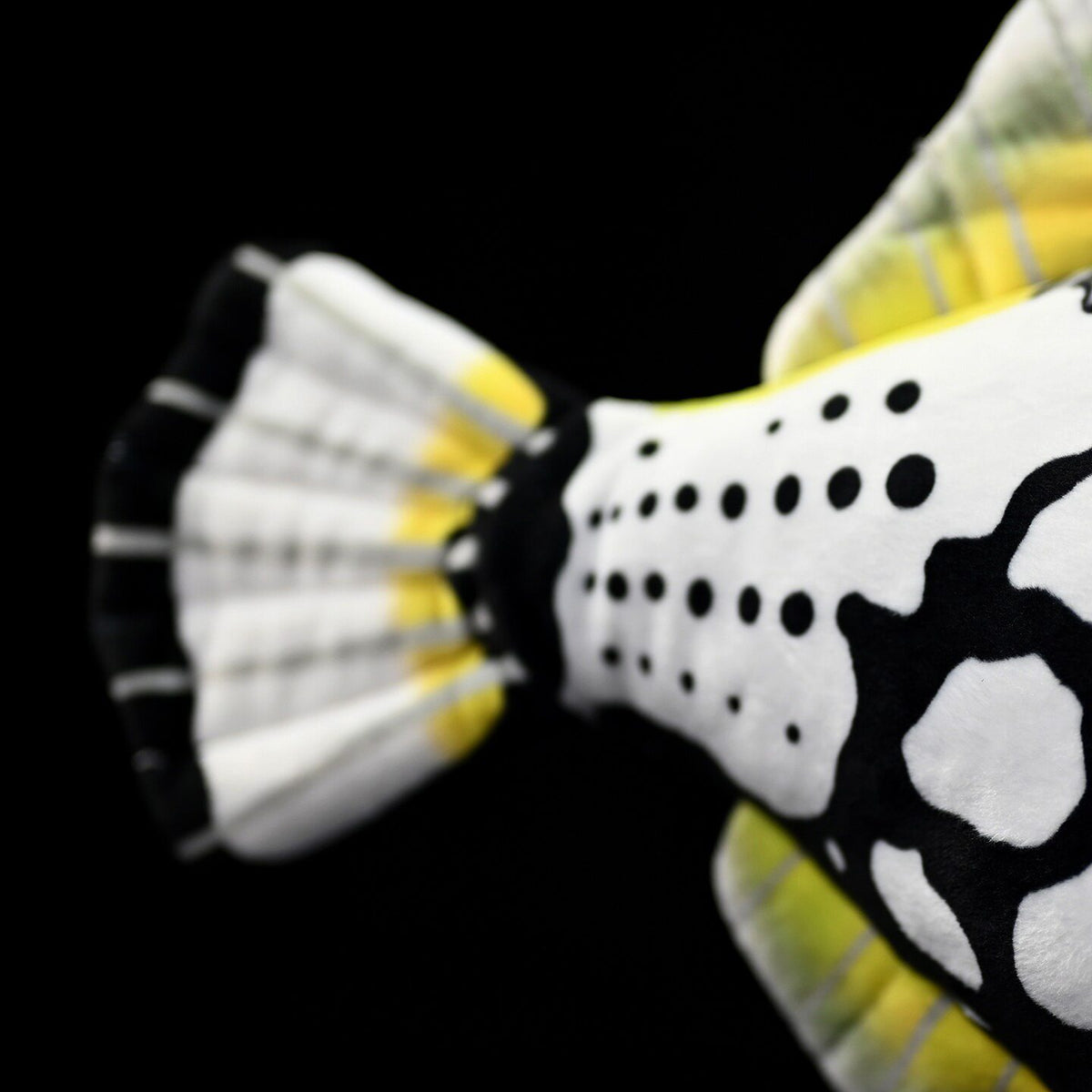Tail detail of the Clown Triggerfish plush by SoftDaysLab®, emphasizing its black, white, and yellow gradient