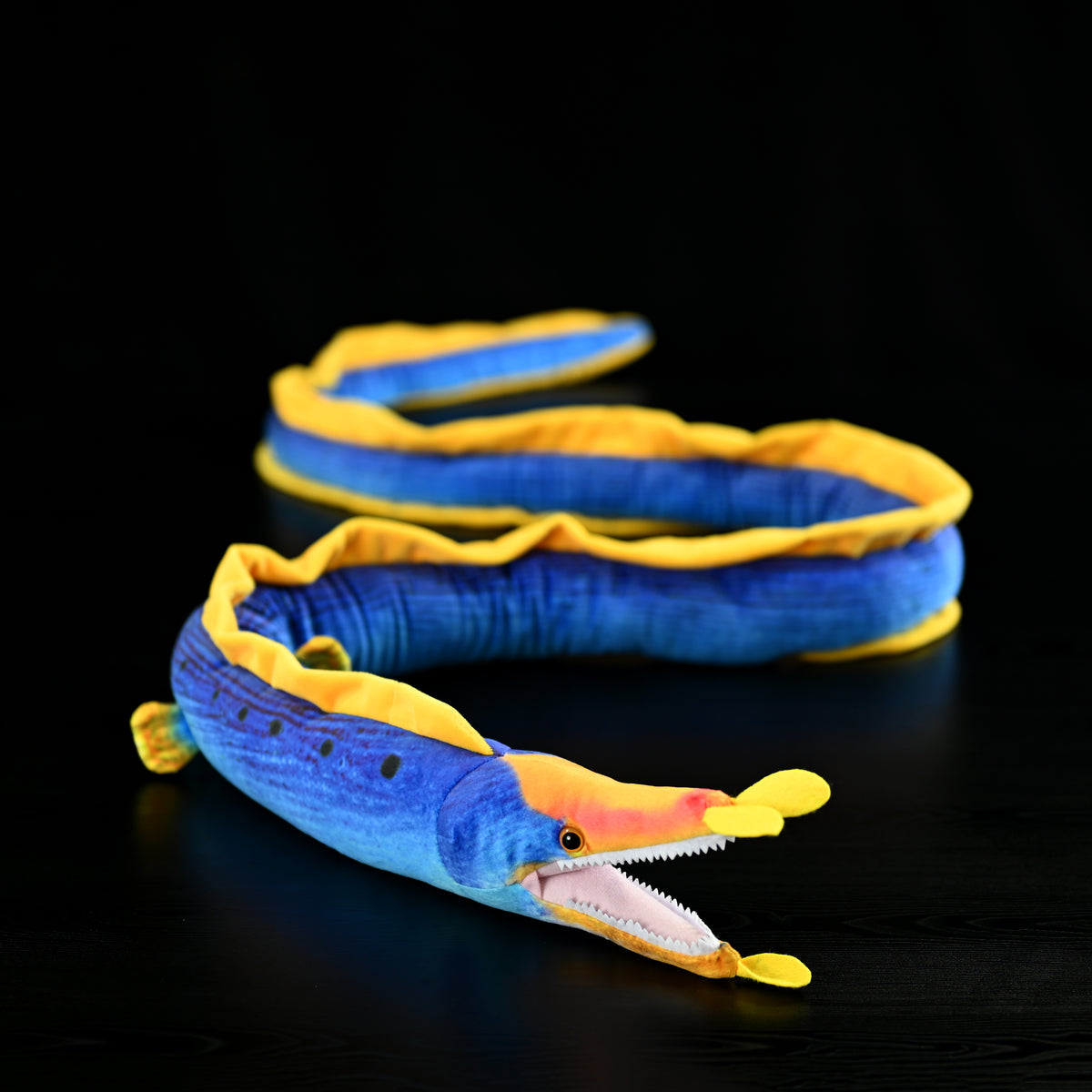Front-side angle of the Ribbon Eel Plush Toy by SoftDaysLab®, highlighting the vibrant yellow and blue colors
