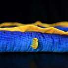 Close-up of the vibrant body textures and yellow fin of the Ribbon Eel Plush Toy by SoftDaysLab®