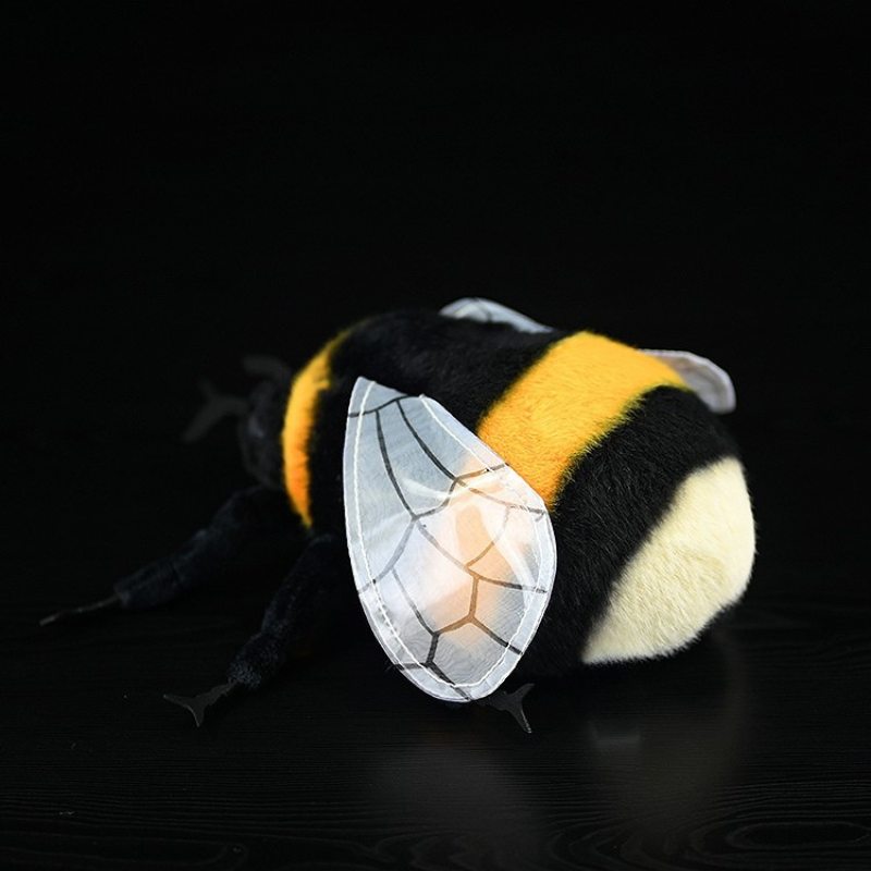 Angled back view of a bumblebee plush toy, featuring lifelike wings and a soft, fluffy body by SoftDaysLab