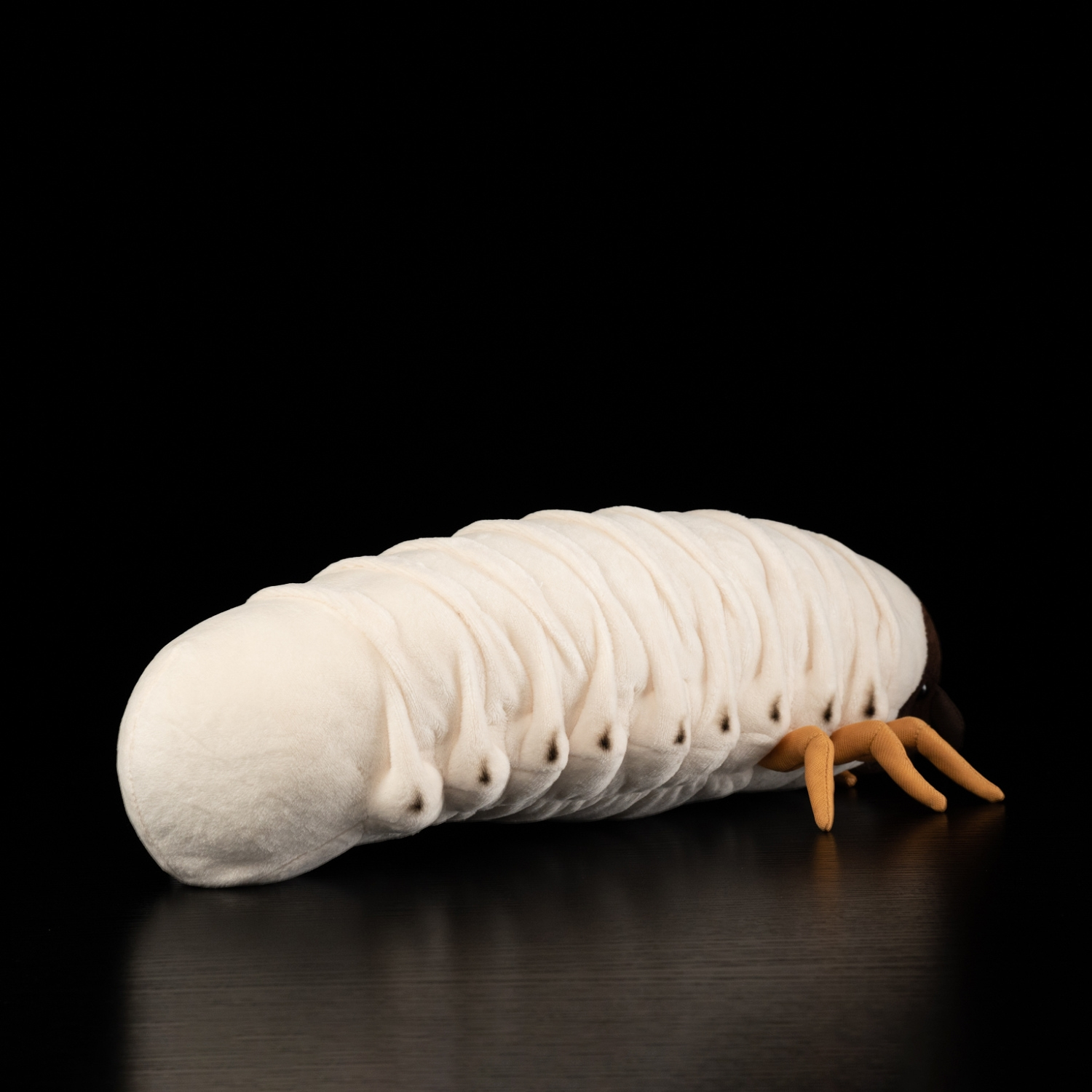 Rear view of a white grub plush toy, showcasing its soft, segmented design and realistic details by SoftDaysLab