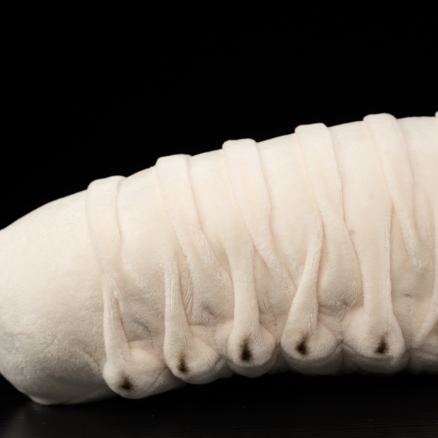 Close-up of the Realistic White Grub Plush Toy’s soft segmented body texture by SoftDaysLab