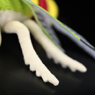 Close-up of the soft legs of the coffee bee hawkmoth plush toy, crafted with realistic texture and design