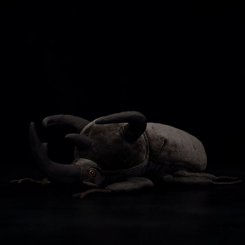 Side view of a realistic Atlas beetle plush toy with lifelike horns and soft fabric by SoftDaysLab