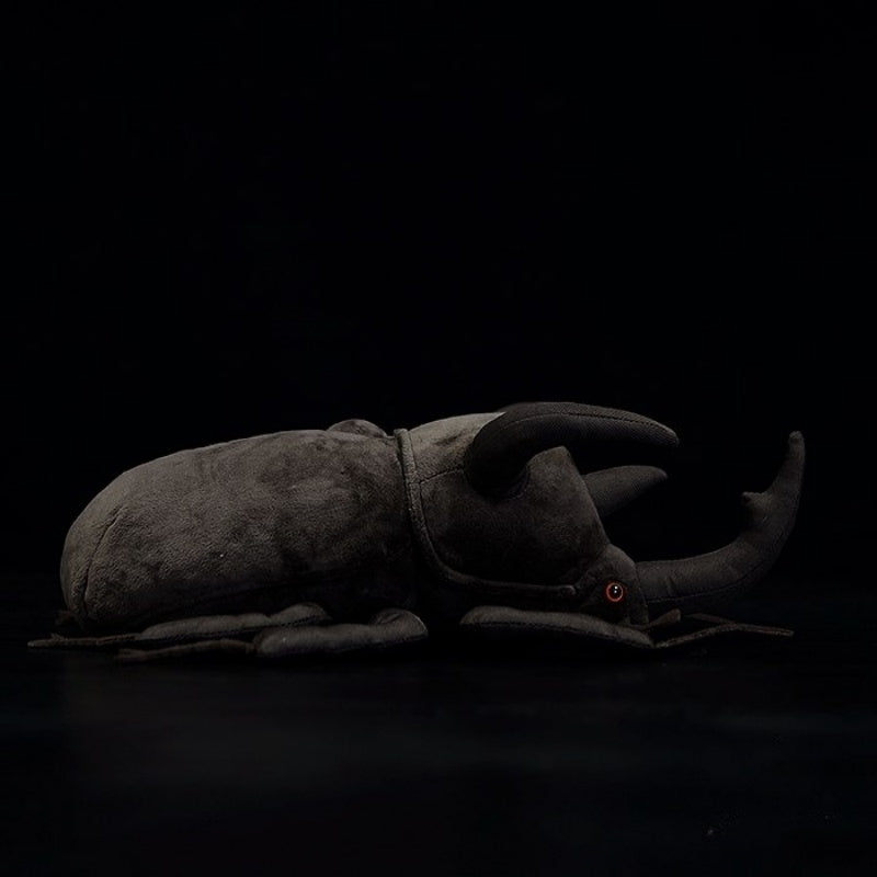 Profile view of a lifelike Atlas beetle plush, highlighting its realistic body and intricate details by SoftDaysLab