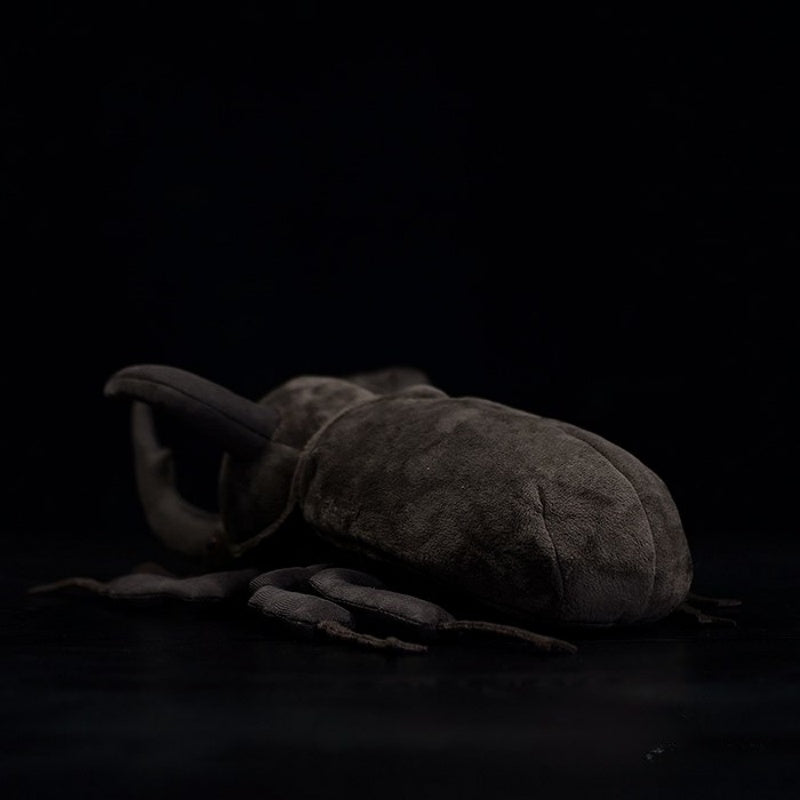 Rear angle of an Atlas beetle plush toy with a soft, smooth texture and realistic craftsmanship